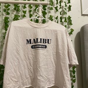 J. Galt, 100% cotton, one size I’m 4,11 and it’s a little big so fits S,M and L